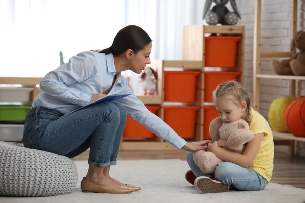child-psychotherapist-working-with-little-girl-in-2026-01-11-11-04-59-utc-69b7ef05c73ae