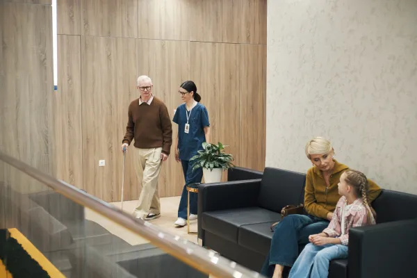 senior-man-walking-with-cane-while-nurse-assisting-2026-01-11-10-51-06-utc-69b7eeba130d5