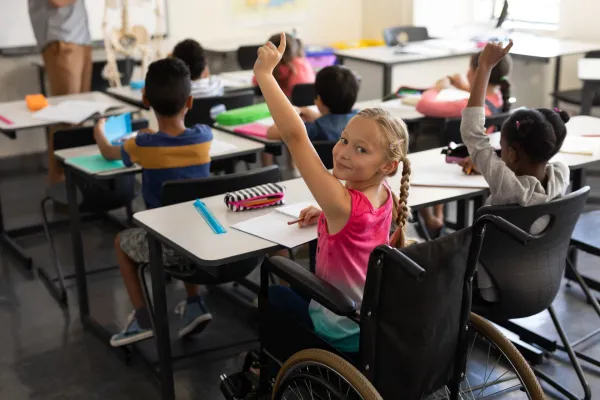 smiling-disable-schoolgirl-looking-at-camera-and-r-2026-01-09-10-55-03-utc-69b7f2bf840c1