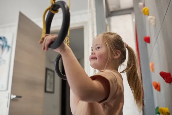 smiling-girl-with-down-syndrome-playing-in-sports-2026-01-09-10-37-48-utc-69b7f2c06d951